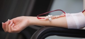 stock-photo-woman-getting-a-transfusion-while-sitting-on-a-chair-114582253