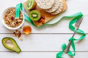 stock-photo-concept-diet-healthy-food-with-muesli-honey-kiwi-and-cereals-581654332